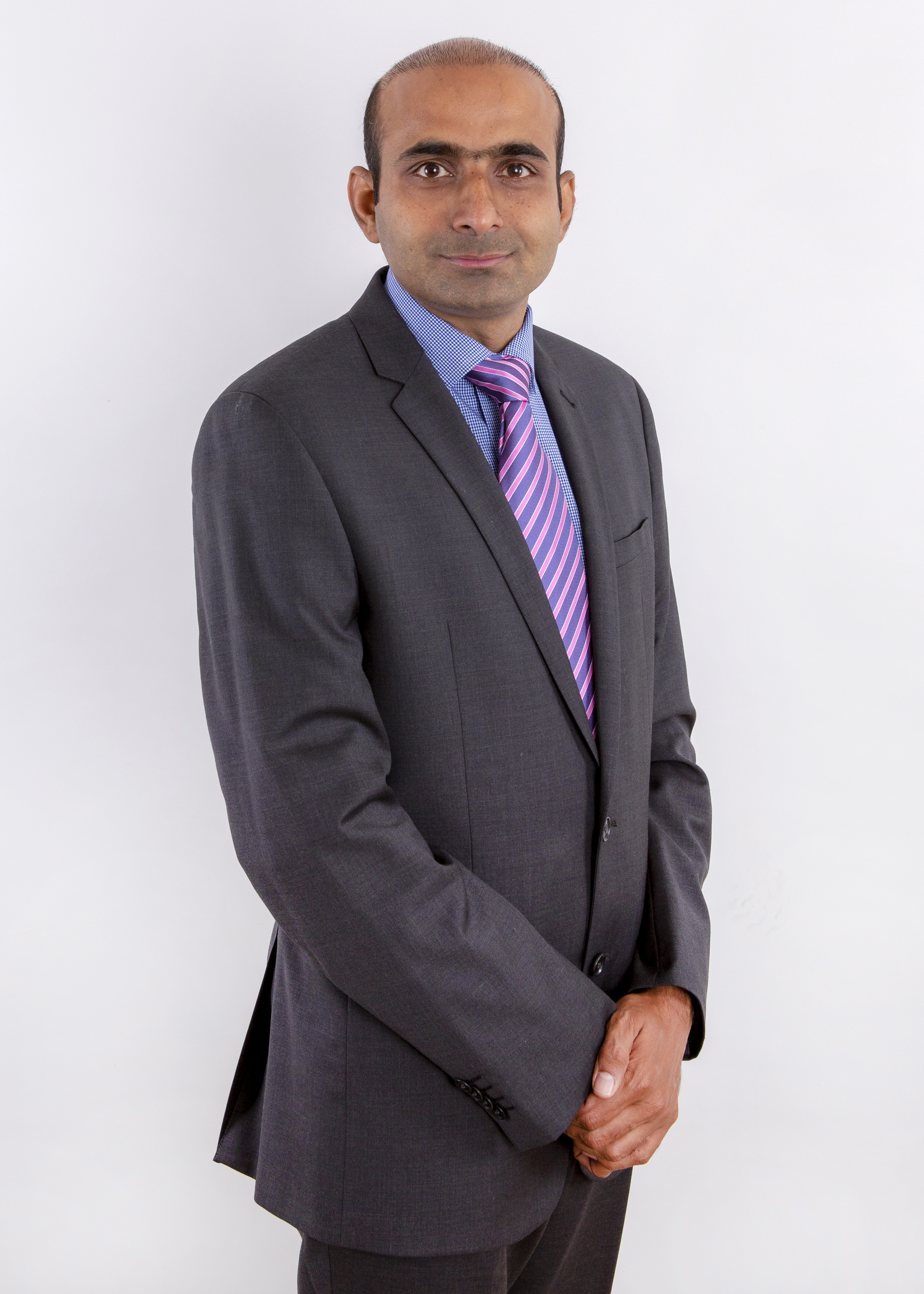 Dr. Yasser Masood — formal portrait